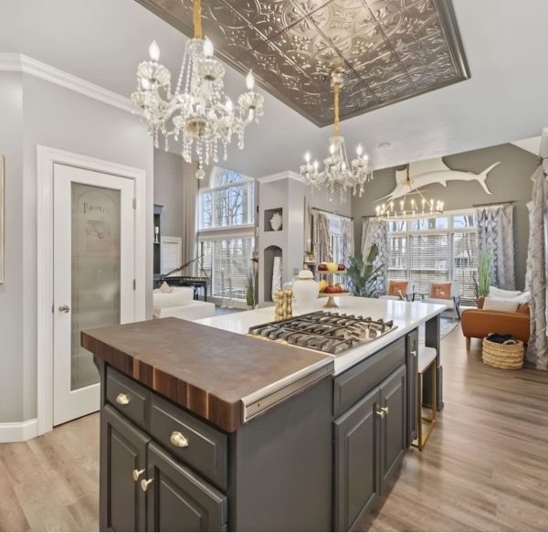 Kitchen renovation with quartz island, shaker cabinetry, and with decorative ceiling detail.